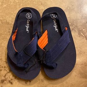 (133) Toddler Boys Dark Blue with Orange Flip Flops by Cat & Jack. Size M 7/8.
